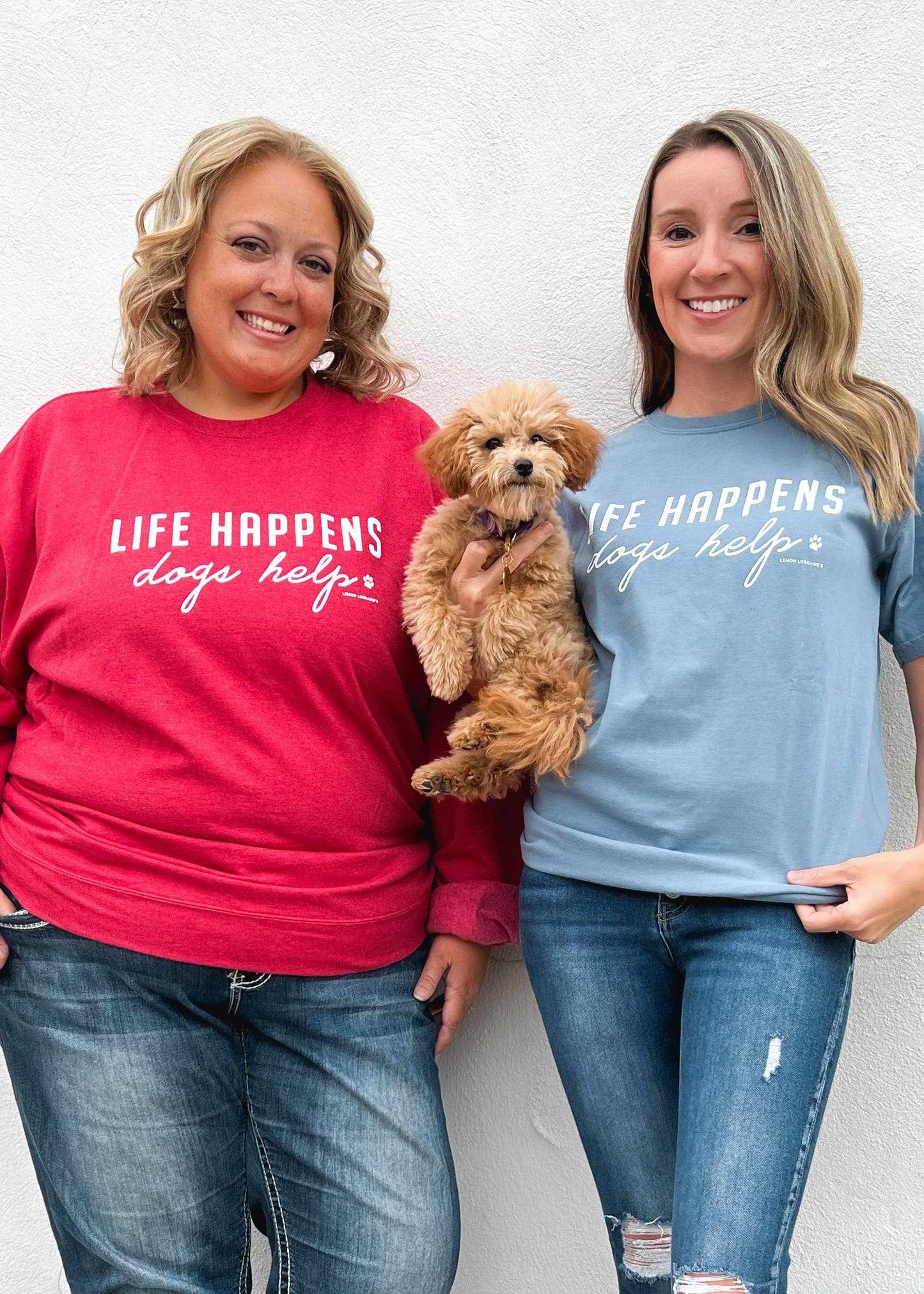 Comfort Wash Graphic Tee in saltwater color with "LIFE HAPPENS DOGS HELP" print, worn by two people and a dog.