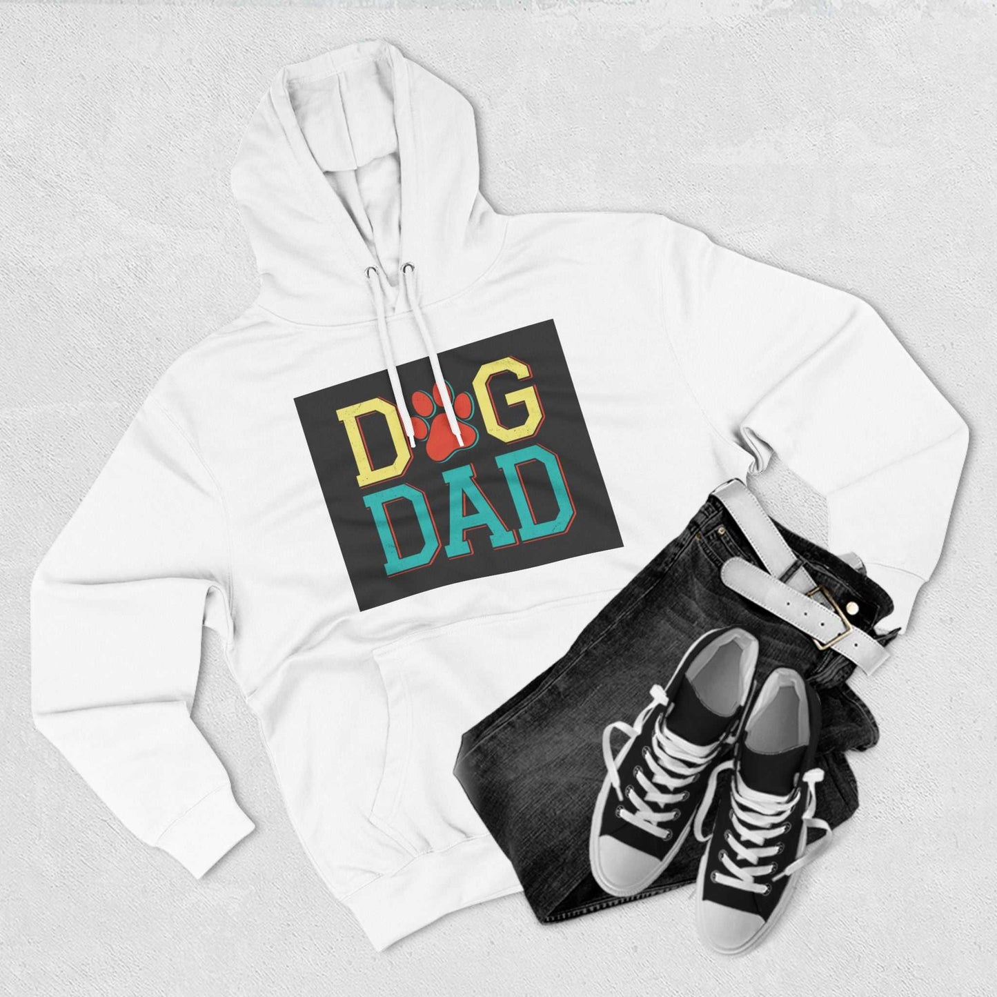 Three Panel Fleece Hoodie with "Dog Dad" design and casual outfit laid out.