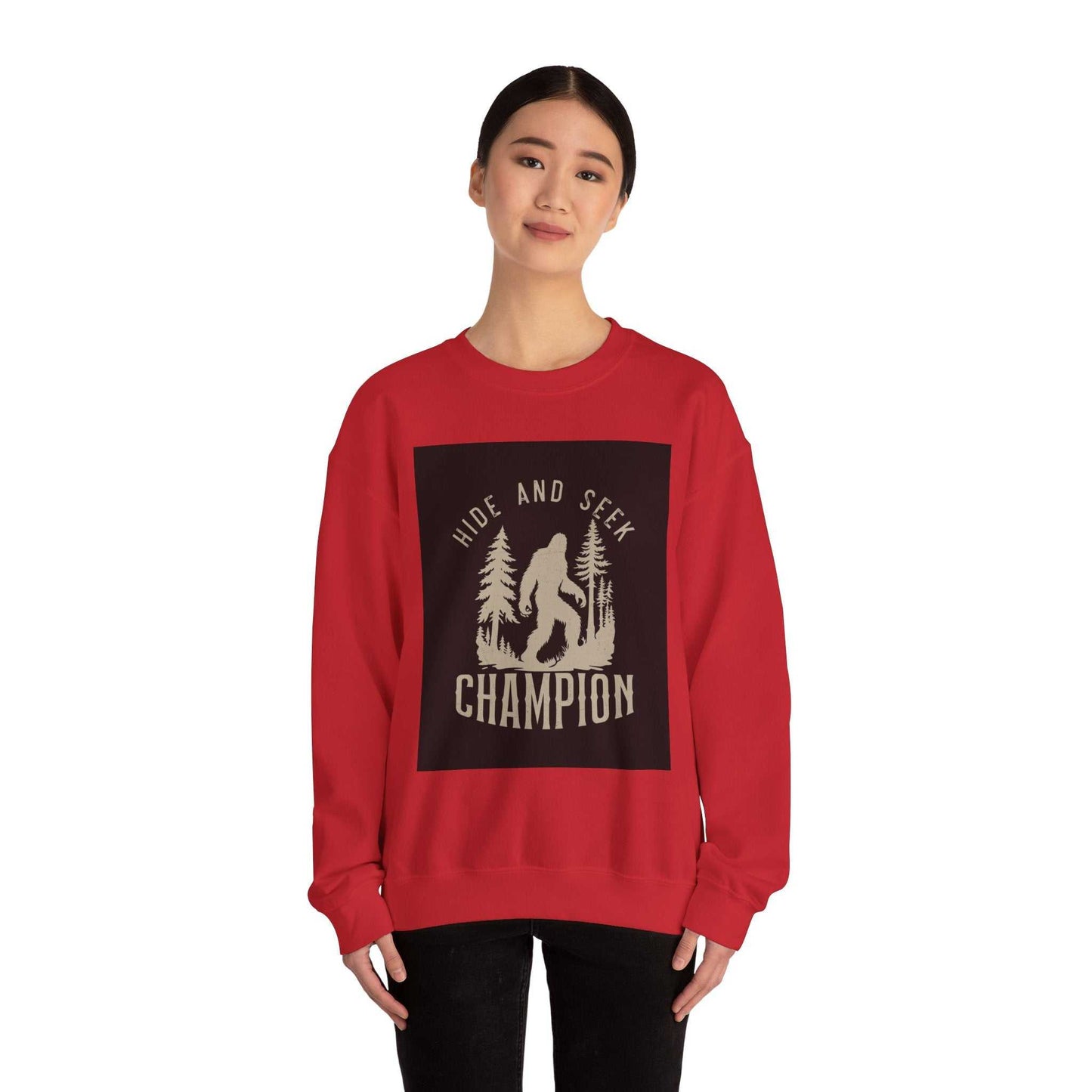 Unisex Heavy Blend™ Crewneck Sweatshirt with "Hide and Seek Champion" design on a red background.
