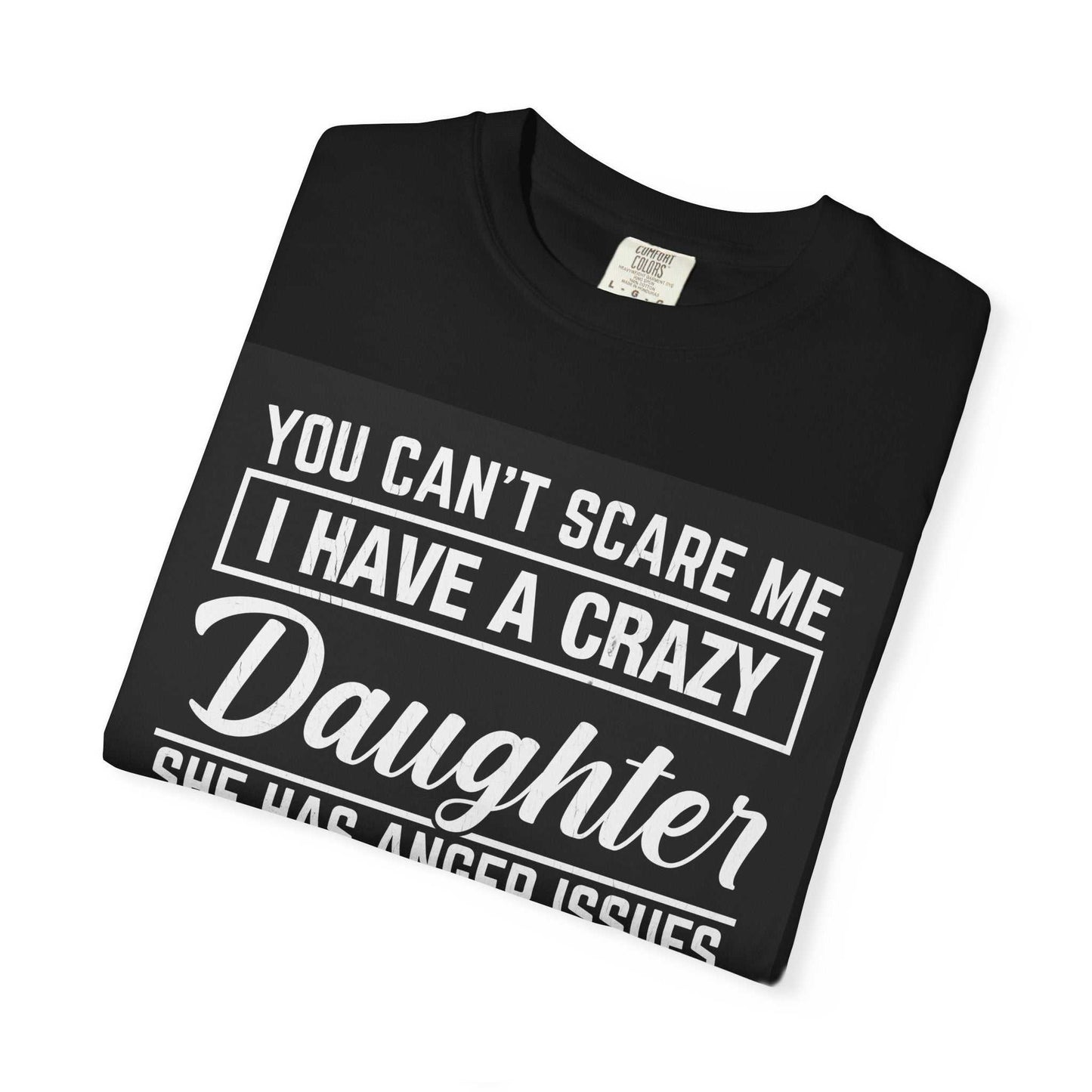 Folded black Comfort Colors 1717 unisex garment-dyed t-shirt with bold text design.