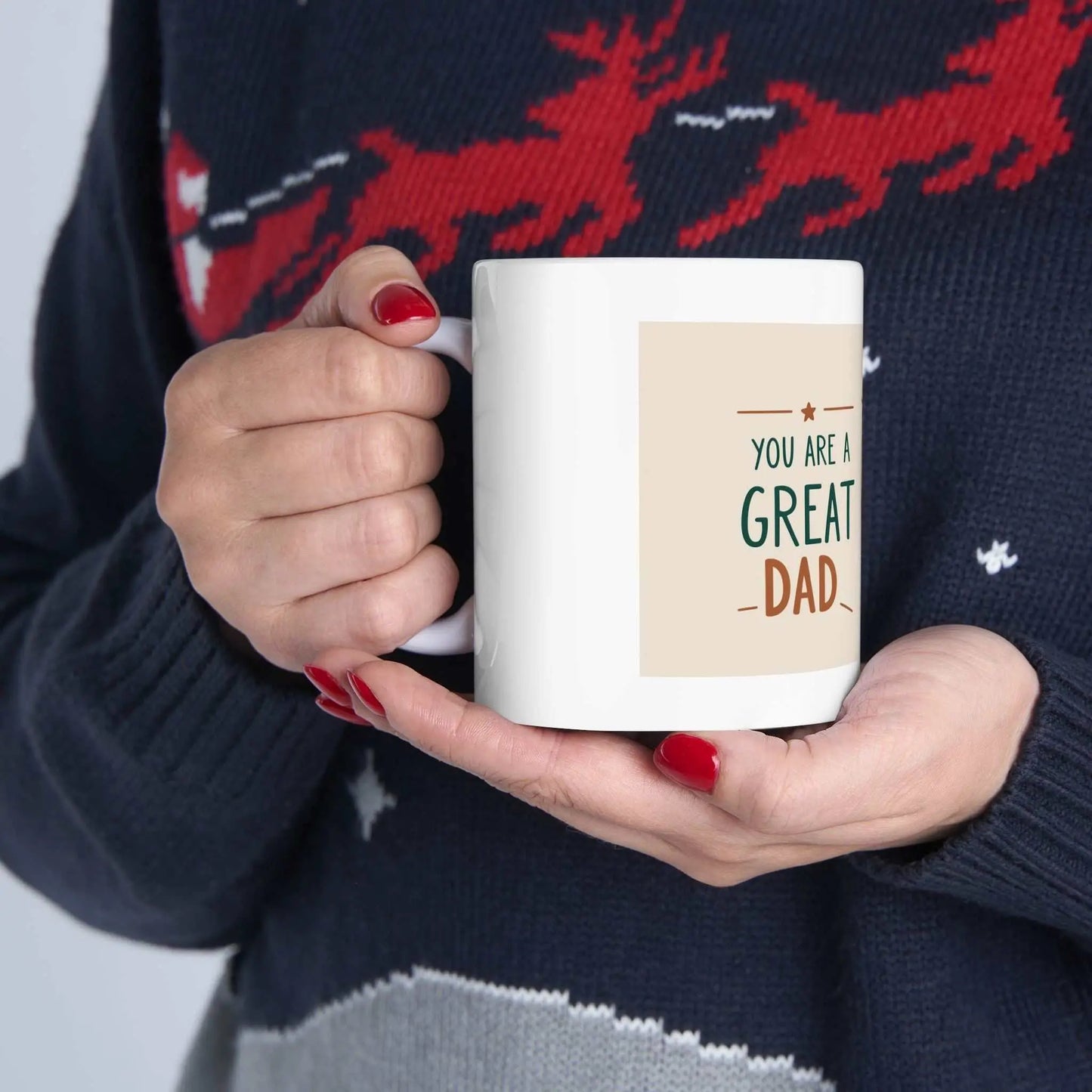 You Are a Great Dad Ceramic Mug with vibrant design held in hands.