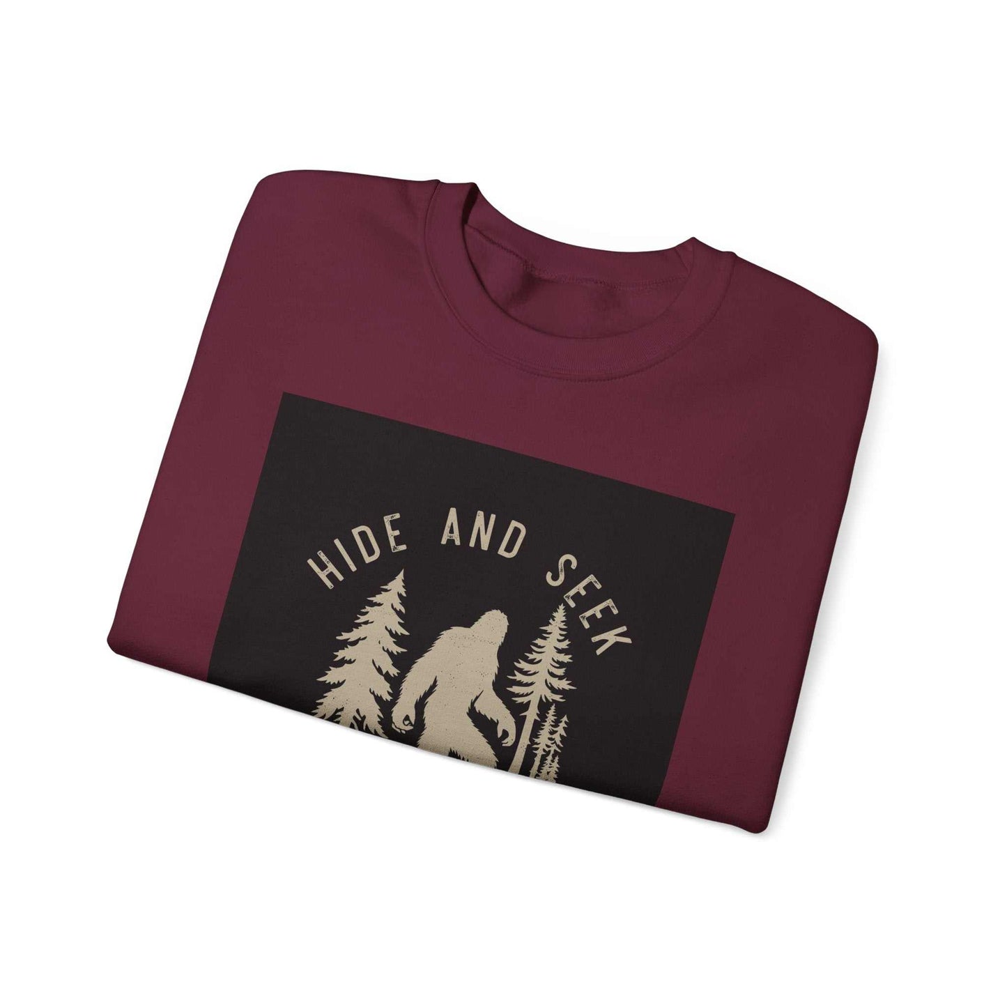 Unisex Heavy Blend™ Crewneck Sweatshirt with "Hide and Seek" design, folded.
