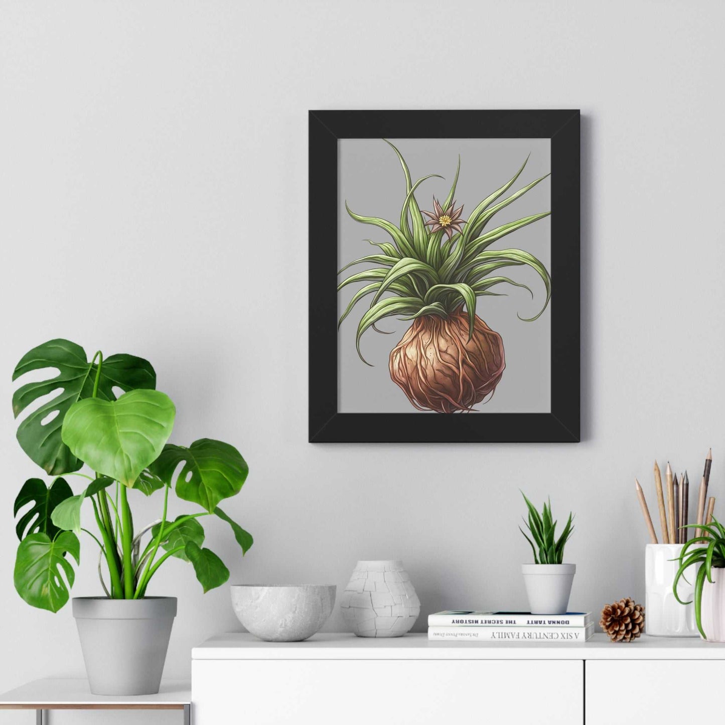 Framed vertical poster with plant illustration, black matte frame, hanging on a modern interior wall.