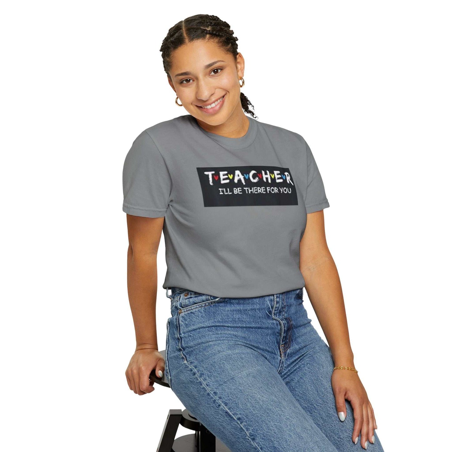 Unisex garment-dyed T-shirt in grey worn by model, showcasing relaxed fit and soft fabric.