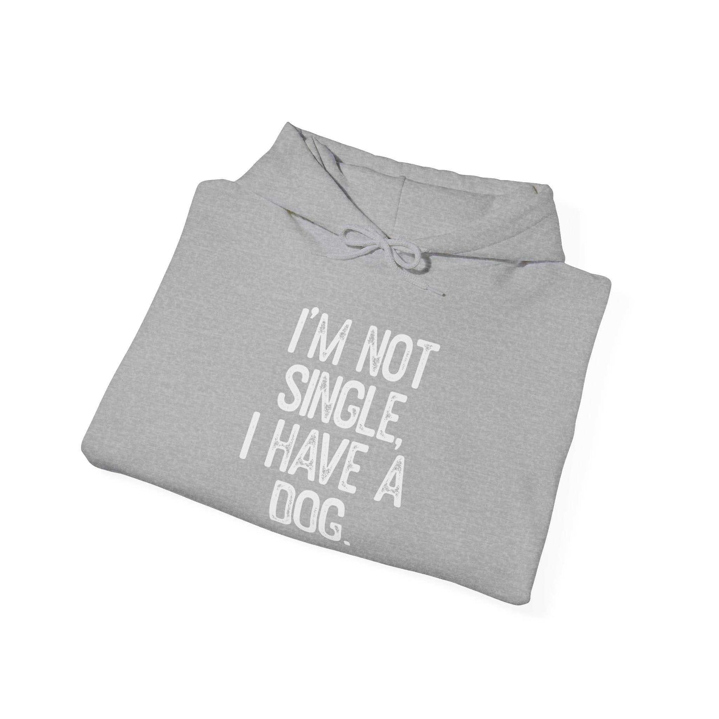 Unisex heavy cotton hoodie, gray with text "I'm not single, I have a dog", folded with matching drawstring.