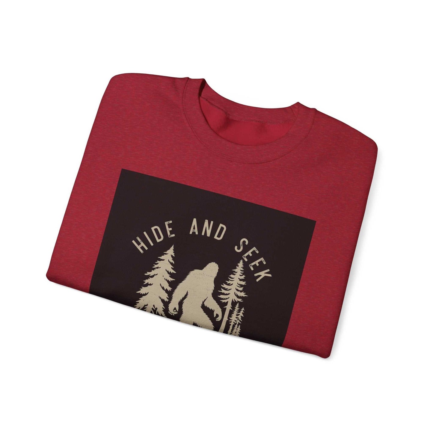 Unisex Heavy Blend™ Crewneck Sweatshirt in red with "Hide and Seek" design featuring a silhouette among trees.