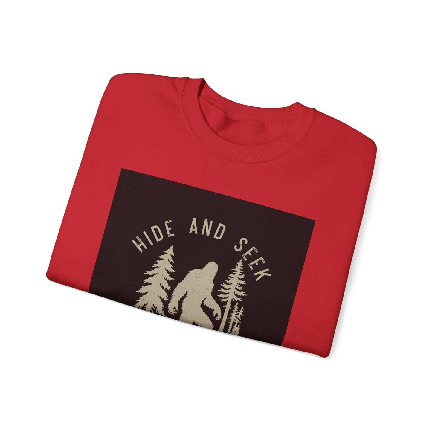 Unisex Heavy Blend™ Crewneck Sweatshirt in red featuring "Hide and Seek" graphic with trees and figure.