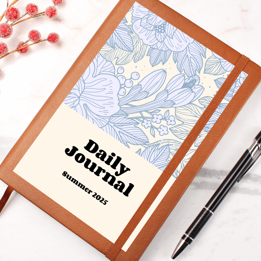 Vegan leather daily journal with floral design and elastic closure, ideal for reflections and goal setting.