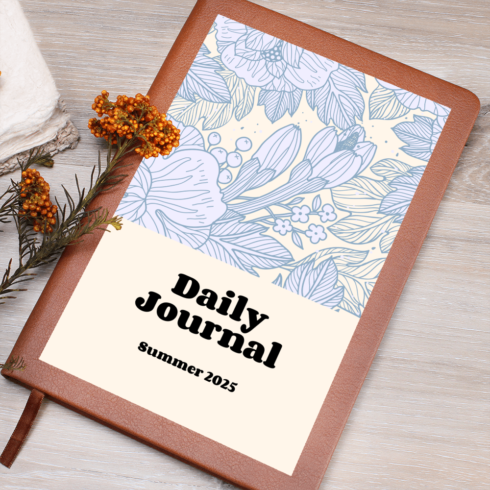 Daily Reflections vegan leather journal with floral design cover, elastic band, and ribbon bookmark.