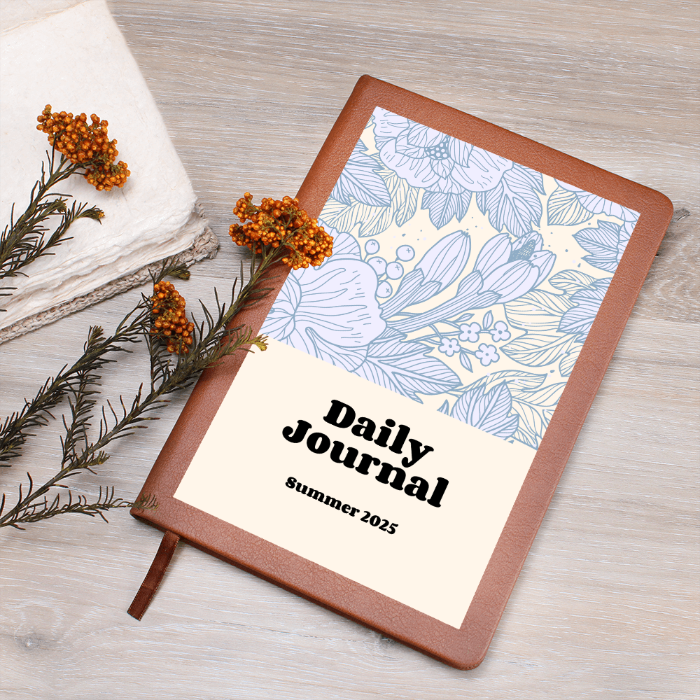 Daily Reflections journal with vegan leather cover, floral design, and ribbon bookmark.