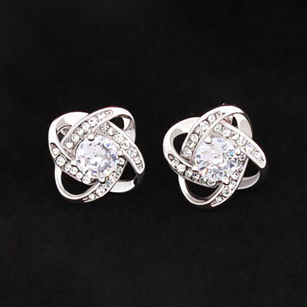 Love Knot Stud Earrings in 14K white gold over stainless steel, featuring a 6mm center CZ.