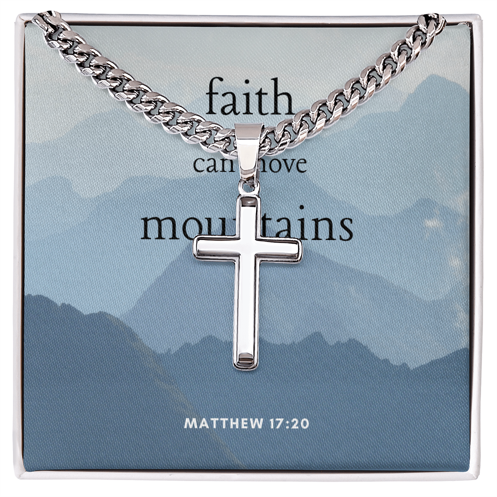 Artisan cross necklace with Cuban link chain on inspirational background.