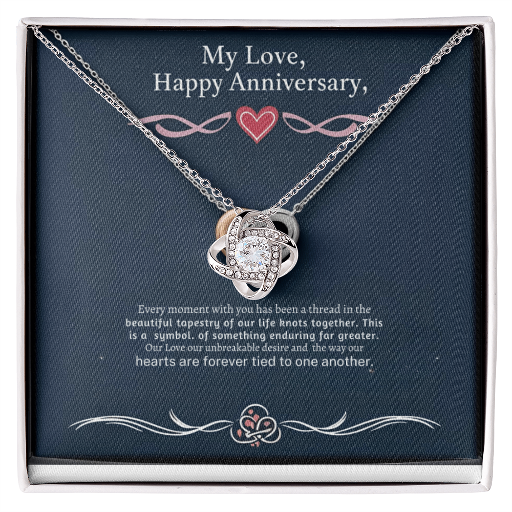Love Knot Necklace with cubic zirconia in gift box.