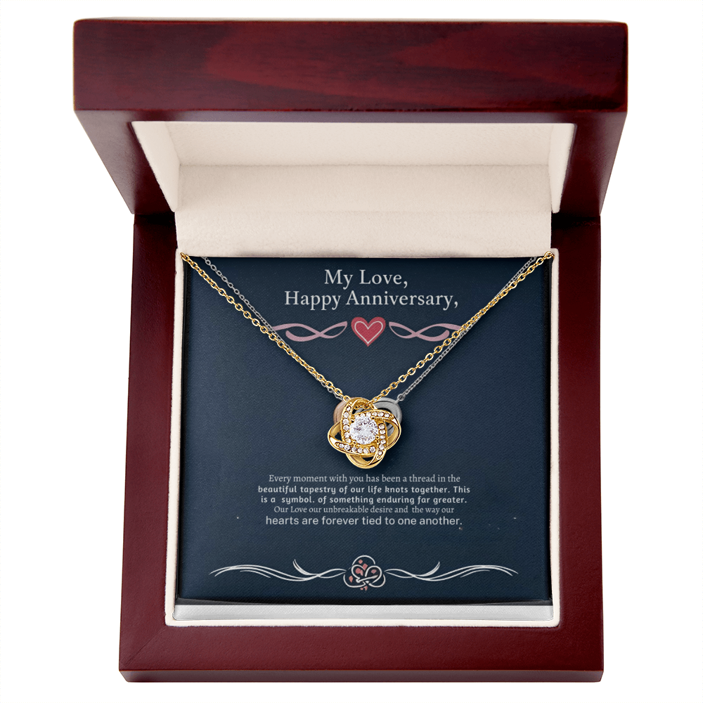 Love Knot Necklace in luxury box with LED spotlight, featuring cubic zirconia pendant.