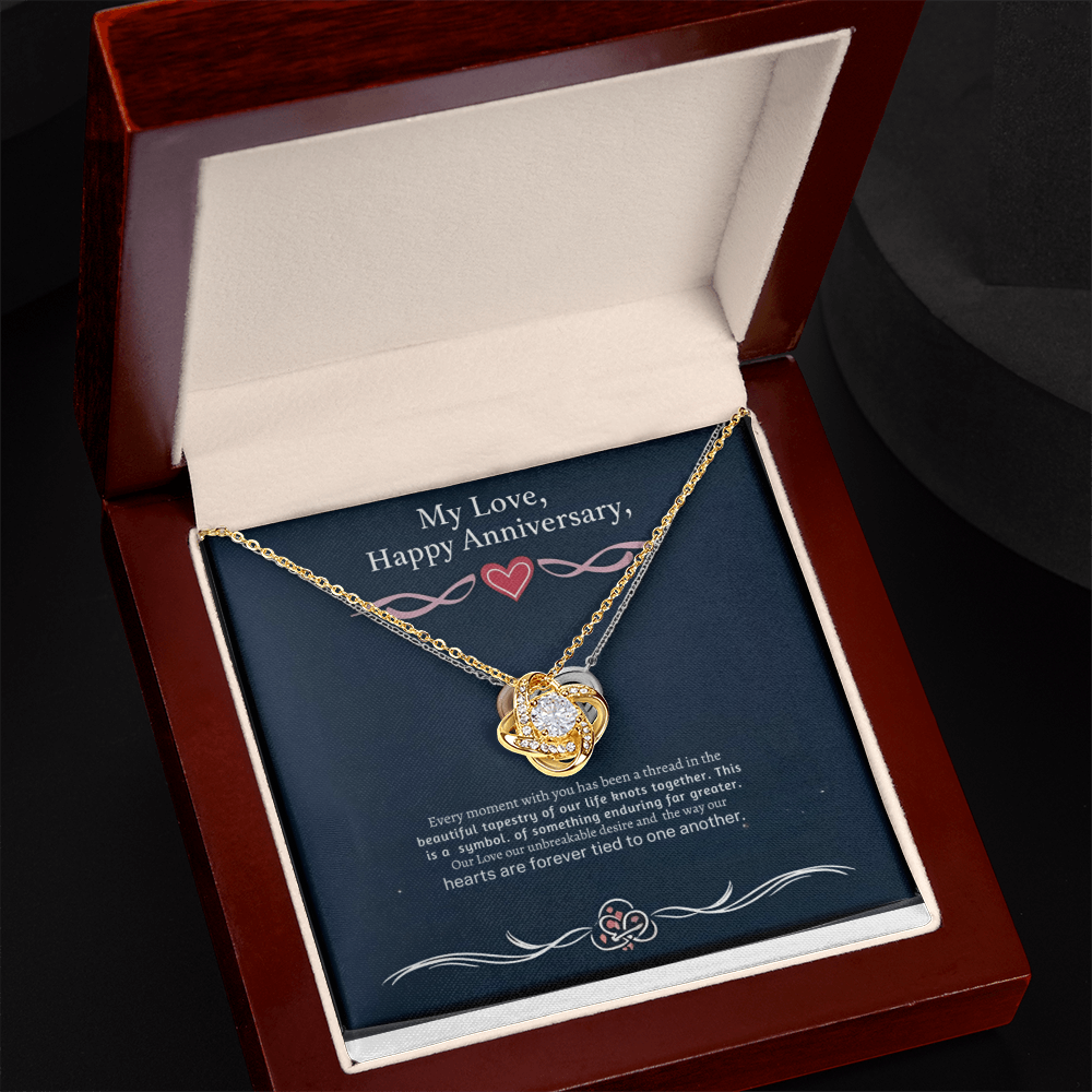 Love Knot Necklace in luxury gift box with LED spotlight, featuring cubic zirconia pendant.