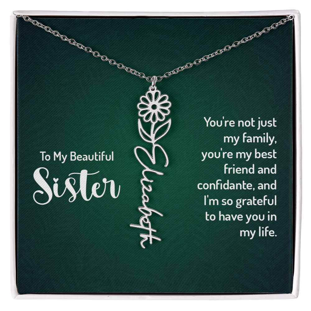Personalized sister necklace with floral design and engraved name on a card with heartfelt message.