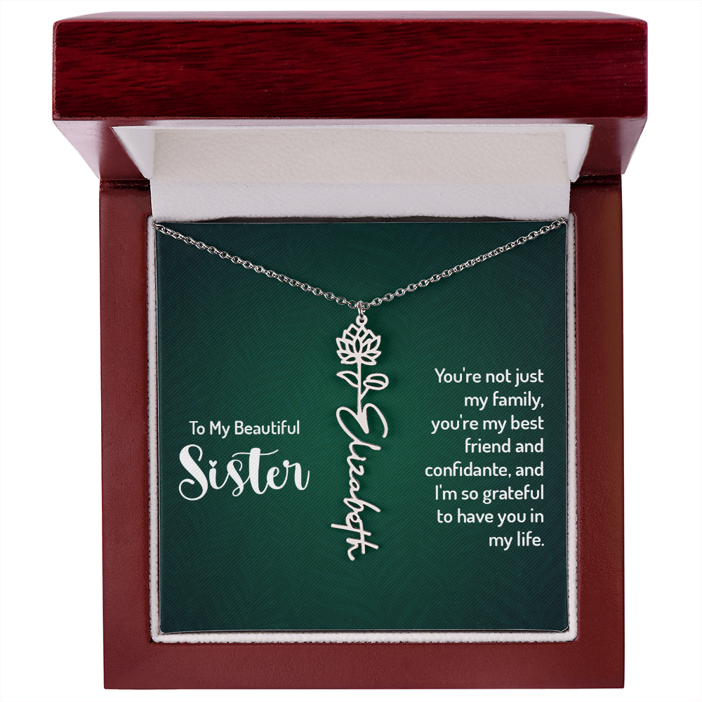 Personalized sister necklace with floral design in decorative gift box.