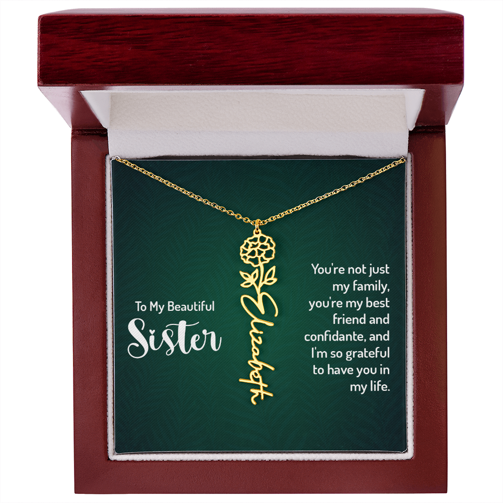 Personalized sister necklace with floral design in gift box.