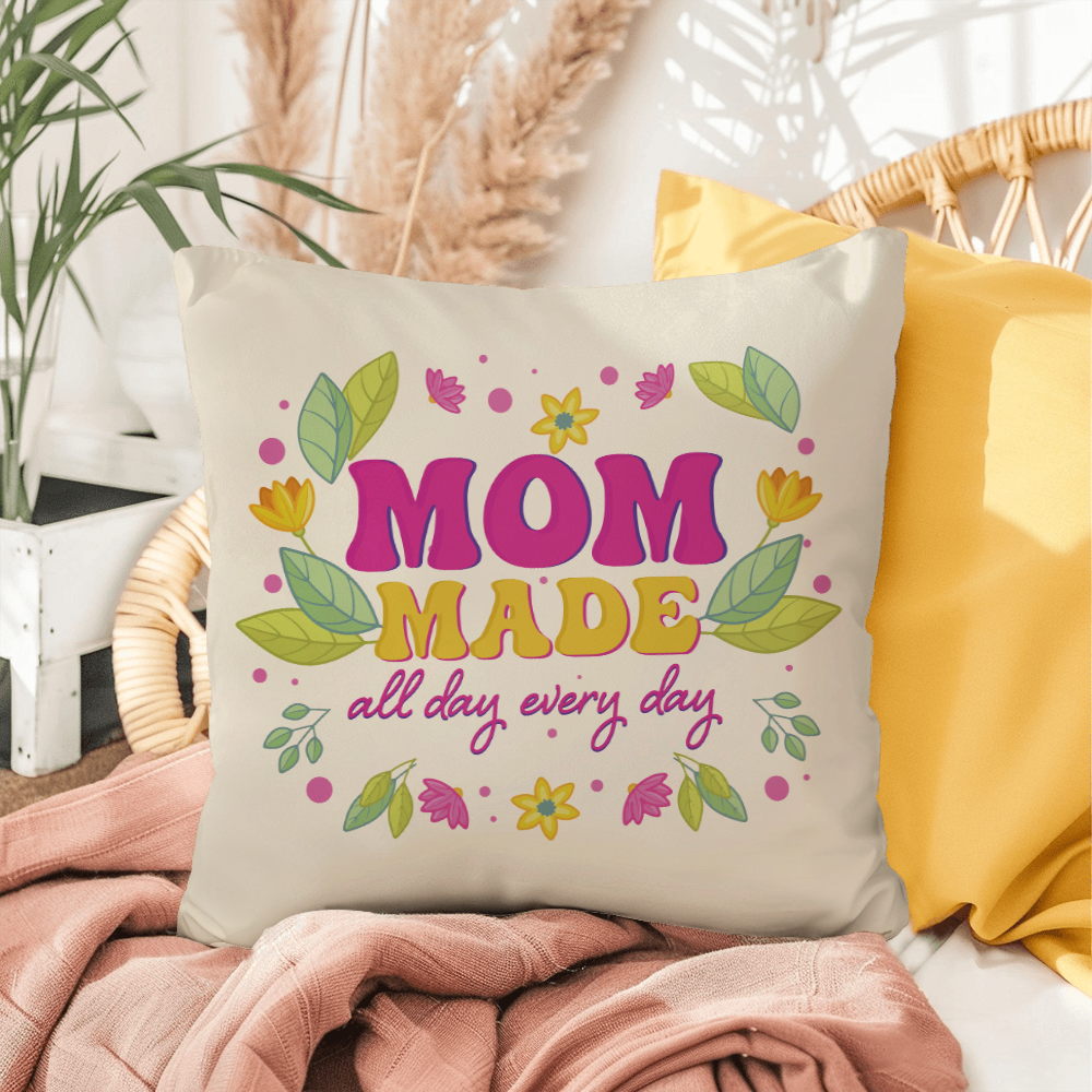 IndoorOutdoor Pillow with floral design and "Mom Made All Day Every Day" text on cozy chair.