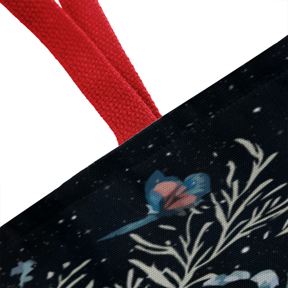 Classic tote bag with floral design and red handles.