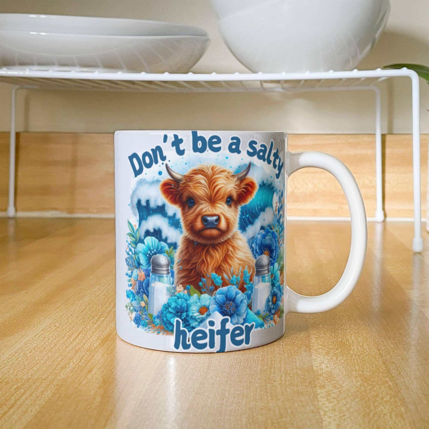 Humorous coffee mug with "Don't be a salty heifer" design, perfect for coffee lovers.