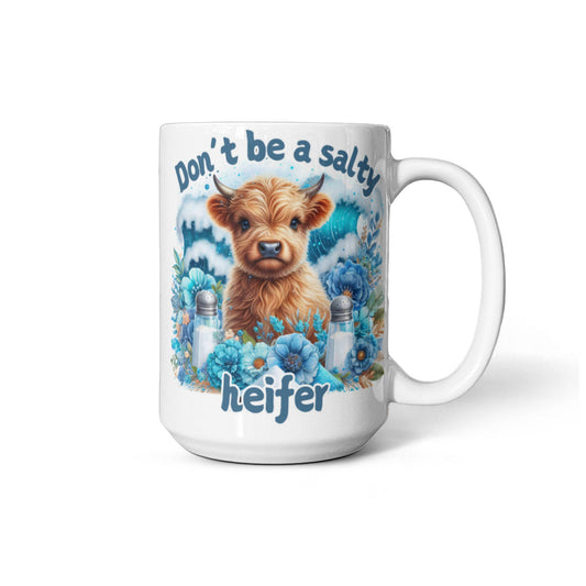 Humorous coffee mug with "Don't be a salty heifer" text, featuring a cute cow design, perfect office gift.