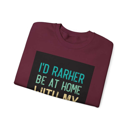 Unisex Heavy Blend™ Crewneck Sweatshirt in burgundy, featuring phrase "I'd Rather Be at Home."