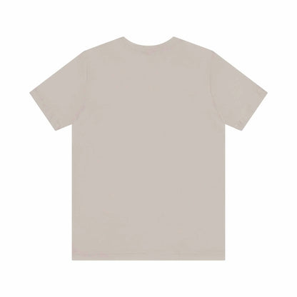 Unisex jersey short sleeve tee in beige color, showcasing the back view with a seamless design and ribbed knit collar.