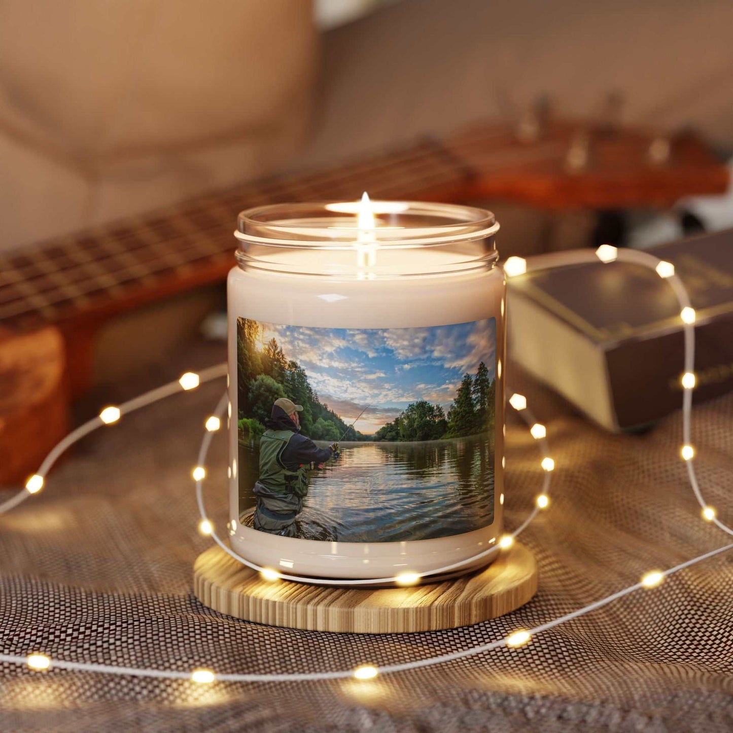Scented soy candle 9 oz in glass jar with custom label, surrounded by decorative lights.