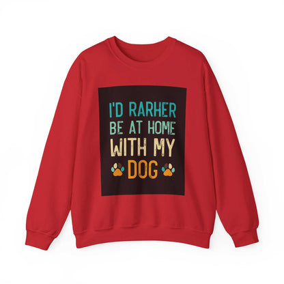 Red unisex heavy blend crewneck sweatshirt with "I'd rather be at home with my dog" slogan, showcasing paw prints.