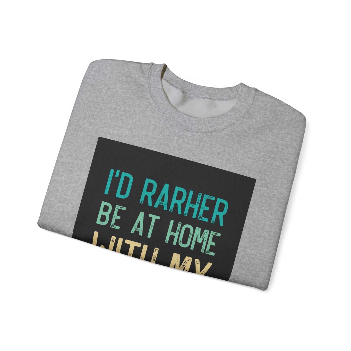 Unisex Heavy Blend™ Crewneck Sweatshirt, gray, folded with text "I'd rather be at home" printed on it.
