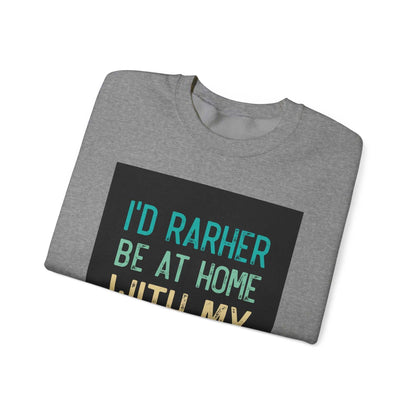 Unisex Heavy Blend™ Crewneck Sweatshirt in gray with the text "I'd rather be at home" on the front, highlighting a comfortable and classic design.