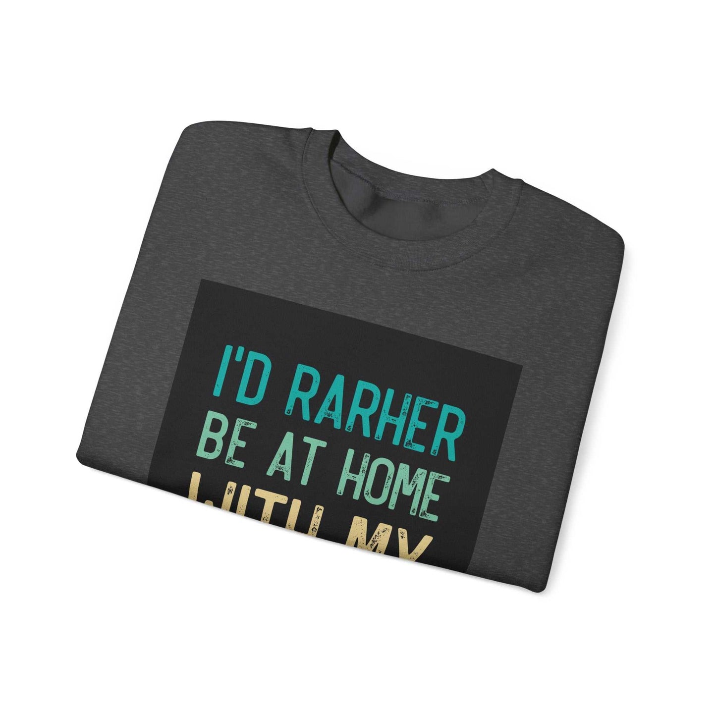Unisex Heavy Blend™ Crewneck Sweatshirt folded with graphic text "I'd Rather Be at Home".