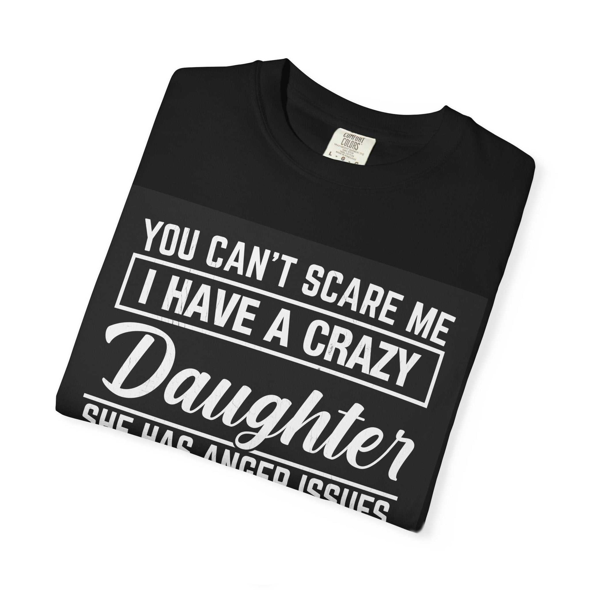 Folded black Comfort Colors 1717 unisex garment-dyed t-shirt with bold text design.
