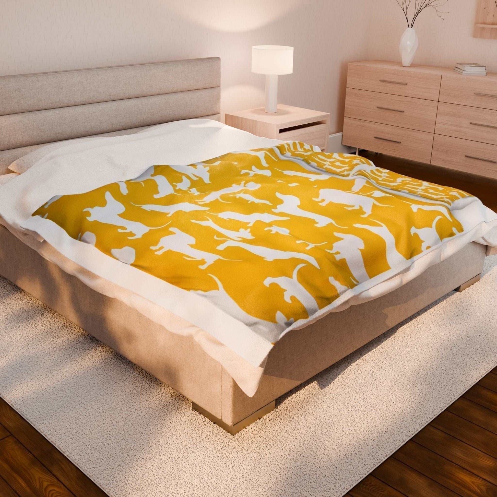 Velveteen plush blanket with dog print for dog lovers, soft and warm, on a bed in a cozy bedroom setting.