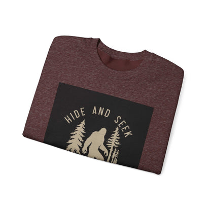 Unisex Heavy Blend™ Crewneck Sweatshirt folded with "Hide and Seek" design, brown.