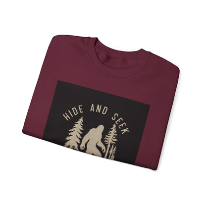 Unisex Heavy Blend™ Crewneck Sweatshirt with "Hide and Seek" design, folded.