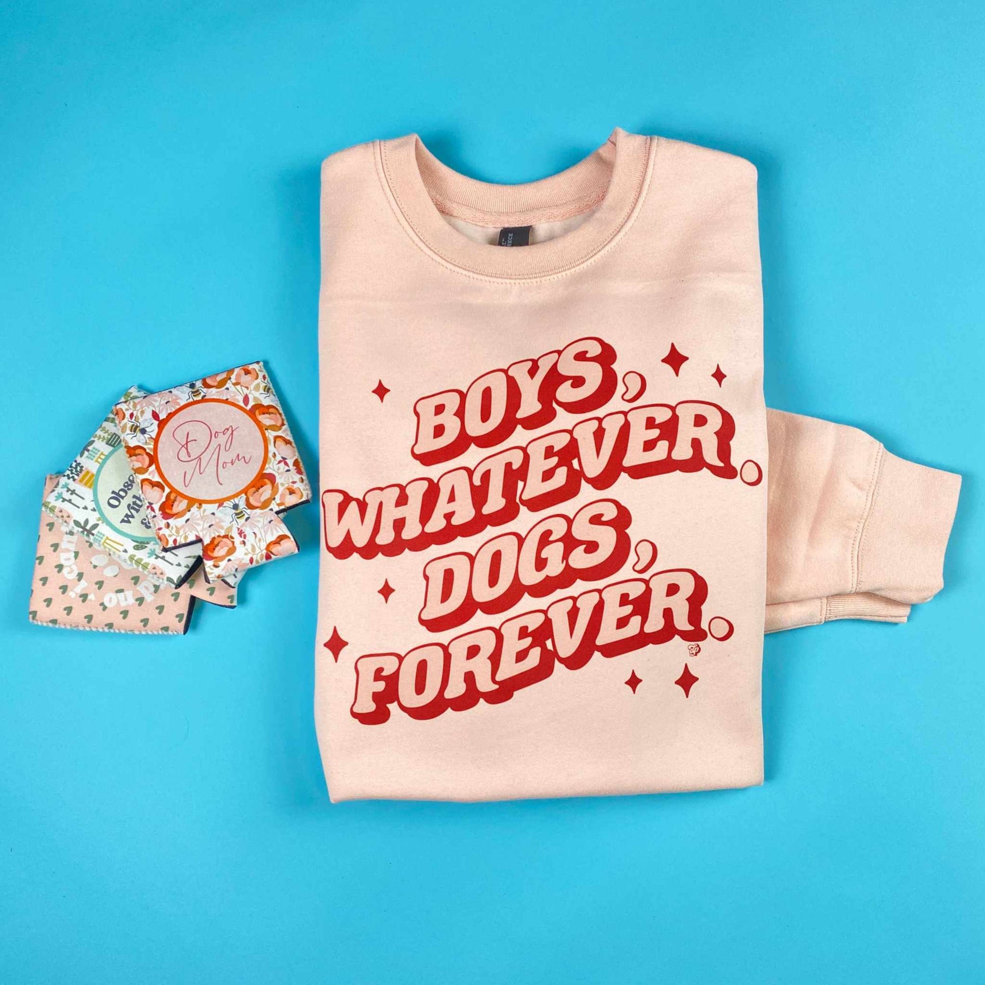 Retro Wave Dogs Forever sweatshirt in rose pink with multicolored DTG print on blue background.
