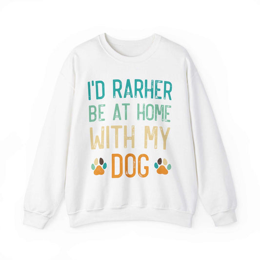 Unisex heavy blend crewneck sweatshirt with colorful text saying "I'd Rather Be At Home With My Dog," featuring paw prints on the front.
