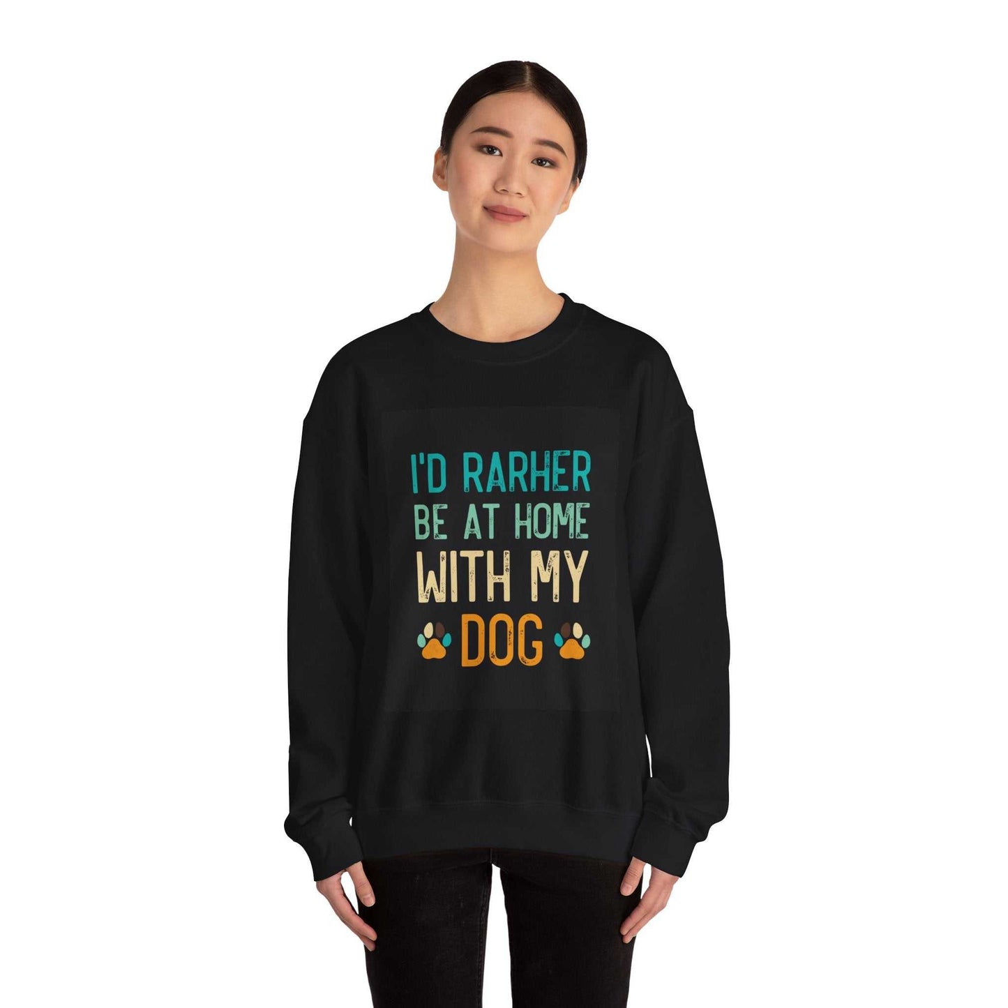 Unisex heavy blend crewneck sweatshirt with "I'd rather be at home with my dog" text in colorful letters.