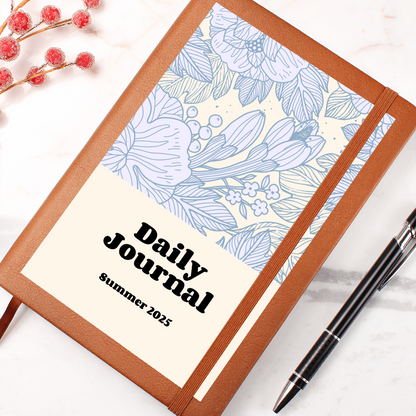 Vegan leather daily journal with floral design and elastic closure, ideal for reflections and goal setting.