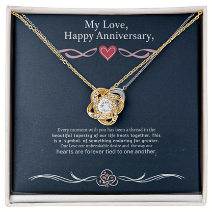 Love Knot Necklace with cubic zirconia, gold finish, in a gift box for anniversaries.