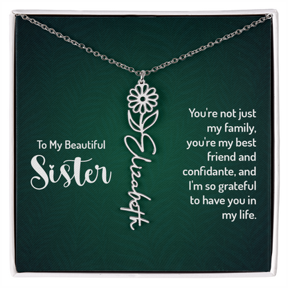 Personalized sister necklace with floral design and engraved name on a card with heartfelt message.