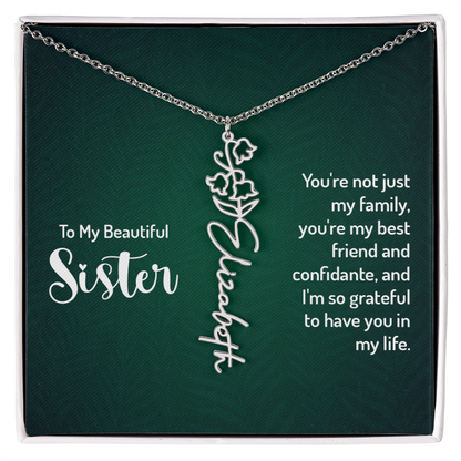 Personalized sister necklace with floral design in gift box, featuring the name "Elizabeth" and a heartfelt message.