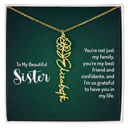 Personalized sister necklace with floral design and cursive name "Elizabeth" on adjustable gold chain, in gift box.