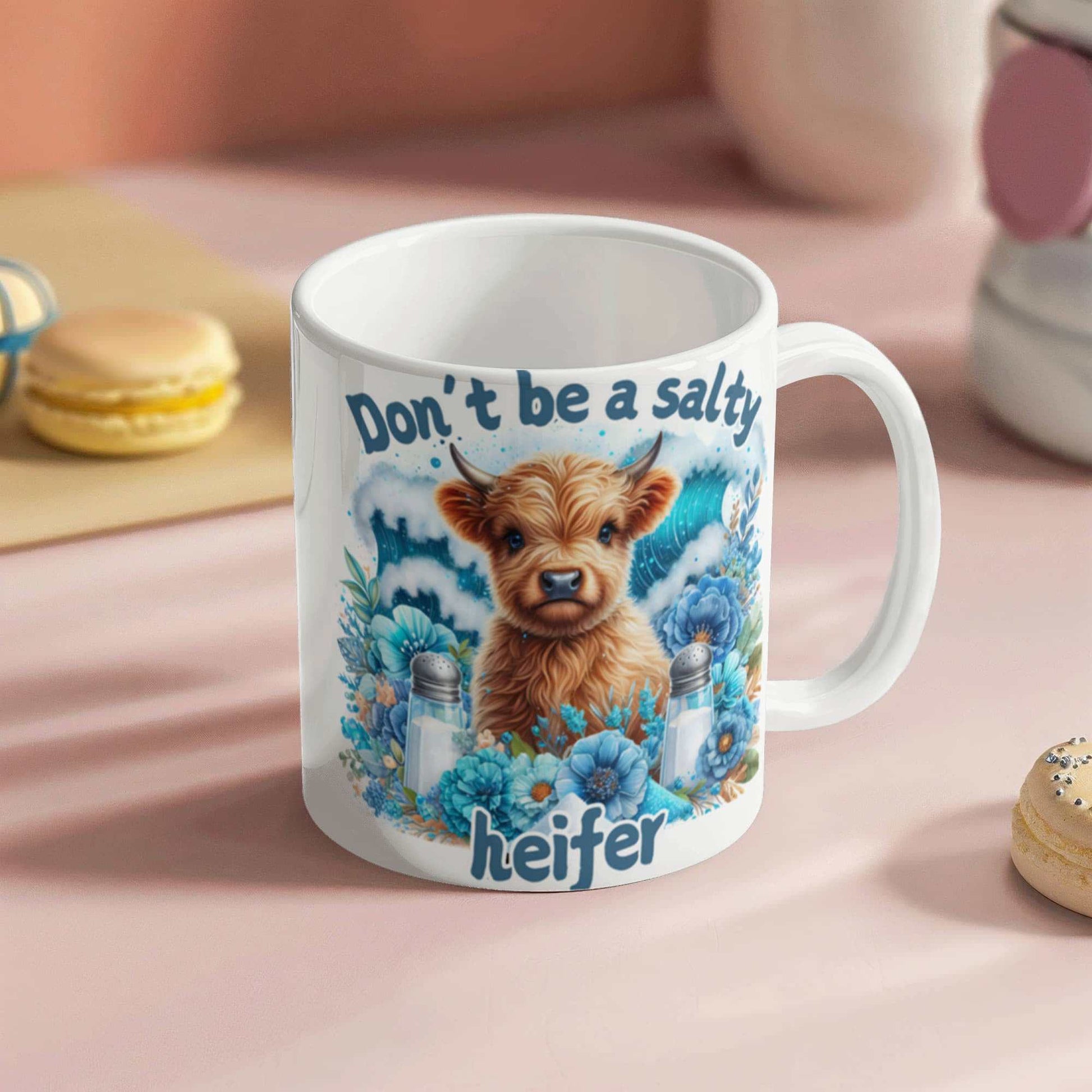 Humorous ceramic coffee mug with "Don't be a salty heifer" design, great gift for coffee lovers.