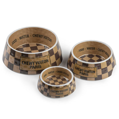 Checker Chewy Vuiton dog bowls in three sizes with chic checkered pattern, non-skid bottom, and side cutout for easy pickup.