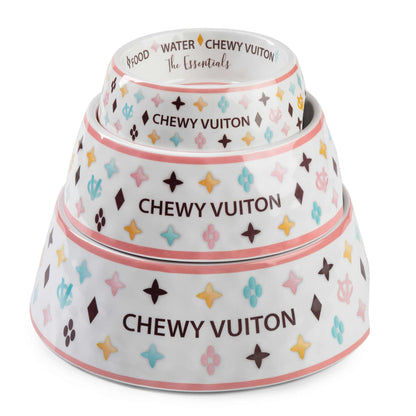 White Chewy Vuiton dog bowls in three sizes with colorful pattern and non-skid bottom.