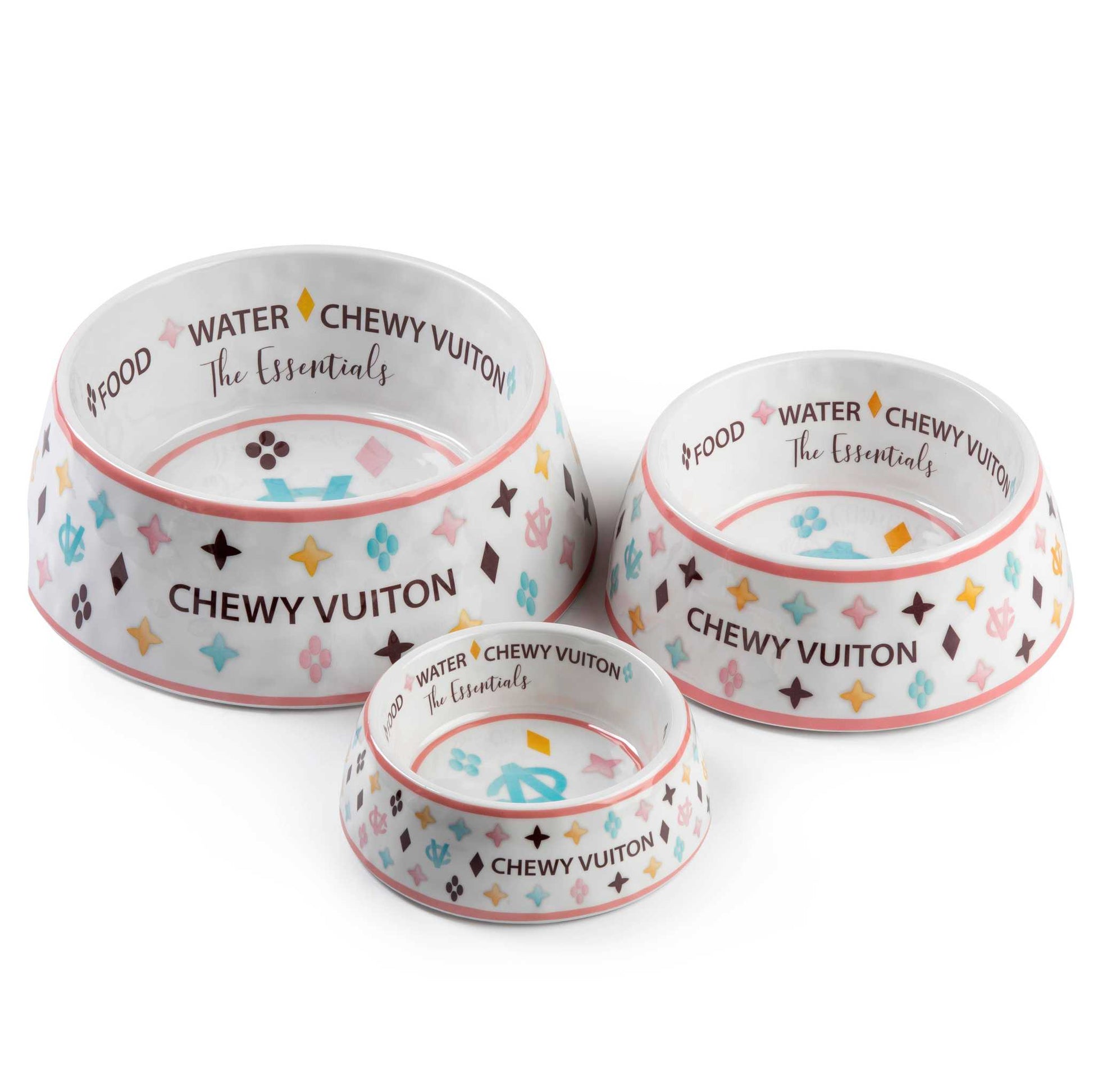White Chewy Vuiton dog bowls in three sizes with colorful designer pattern.