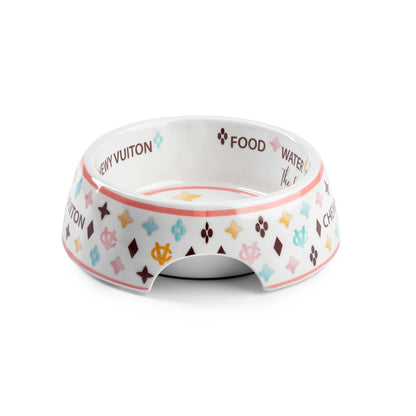 White Chewy Vuiton dog bowl with colorful patterns and non-skid bottom. Chip-resistant and dishwasher safe. Available in three sizes.